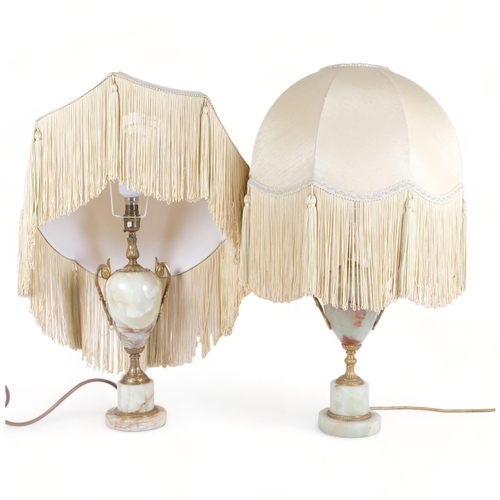 267 - A pair of onyx and gilt-metal table lamps, with frilled shades, H67cm