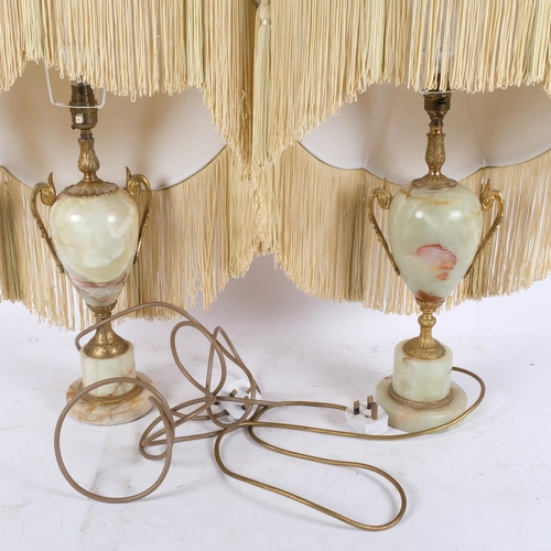 267 - A pair of onyx and gilt-metal table lamps, with frilled shades, H67cm