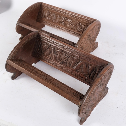 269 - A pair of Anglo-Indian wooden bookracks, with mythical dragon and associated carved decoration, dime... 