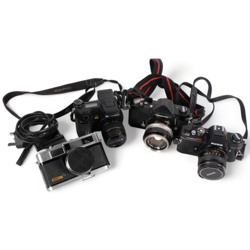 293 - A selection of Vintage cameras and equipment, including a Nikon Nikkormat FT camera, serial no. 4621... 