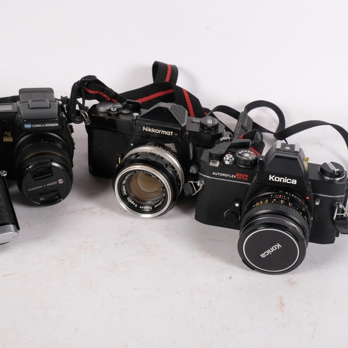 293 - A selection of Vintage cameras and equipment, including a Nikon Nikkormat FT camera, serial no. 4621... 