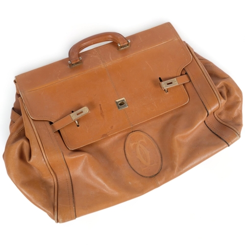 299 - A light tan brown leather holdall, with interwoven stitched monogram, bag length 46cm, depth 31cm, w... 