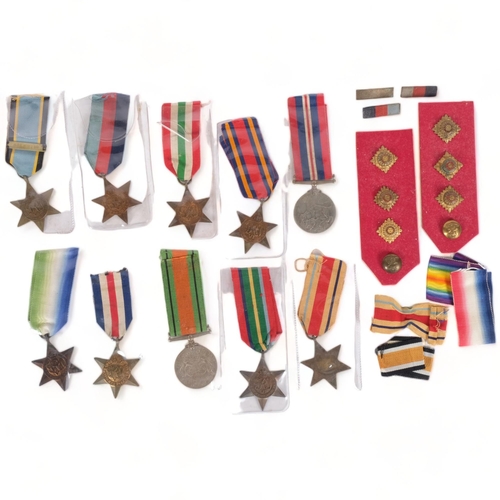 376 - A collection of Second World War medals, cap and tunic badges, including George VI Africa Star, the ... 