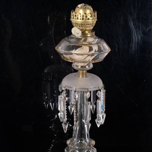 64 - An Antique oak oil lamp, with panelled glass font and arrowhead lustre drops, H56cm