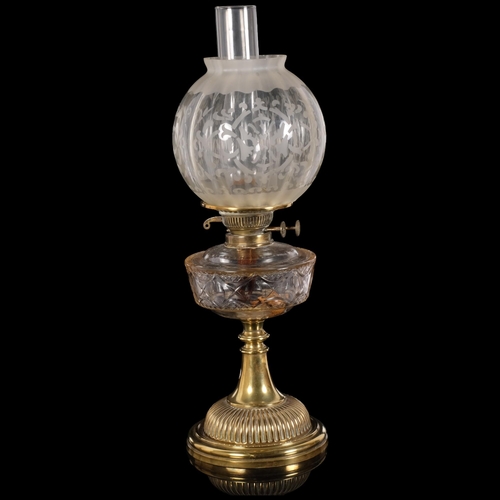 72 - A Victorian brass oil lamp, etched glass shade with clear glass font, H56cm