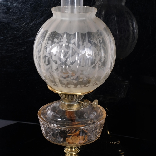 72 - A Victorian brass oil lamp, etched glass shade with clear glass font, H56cm