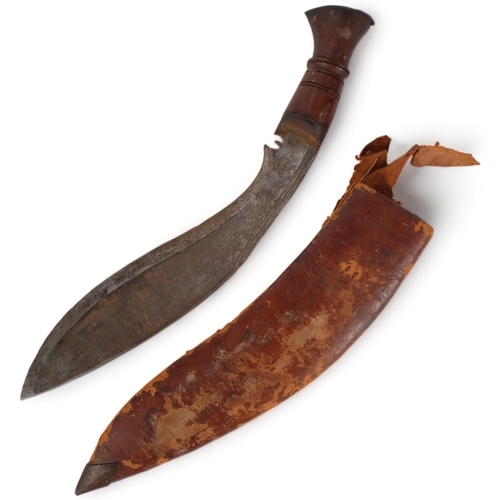 95 - A Malayan kukri in leather scabbard, blade length 30cm, overall length 42cm