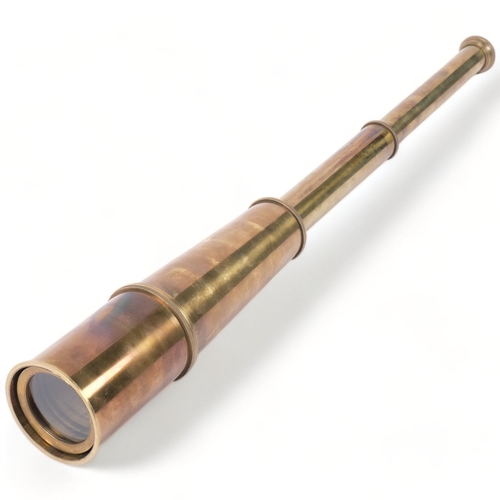 702 - A reproduction brass 4-draw telescope