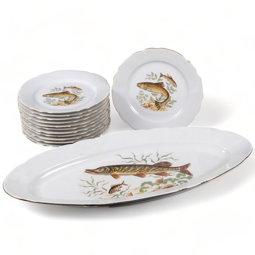 706 - A set of 12 West German porcelain fish plates, including server, L58cm