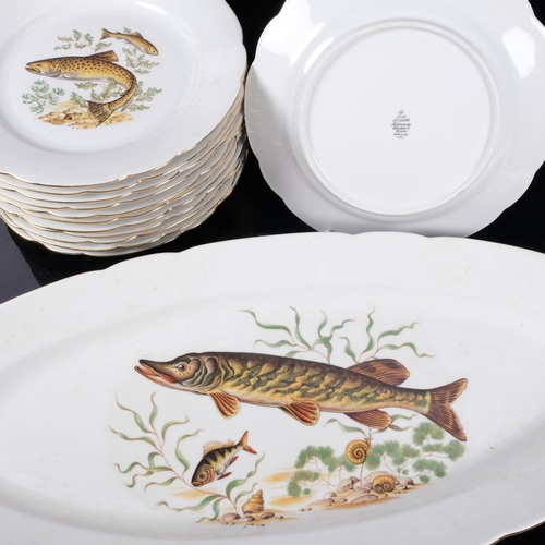 706 - A set of 12 West German porcelain fish plates, including server, L58cm