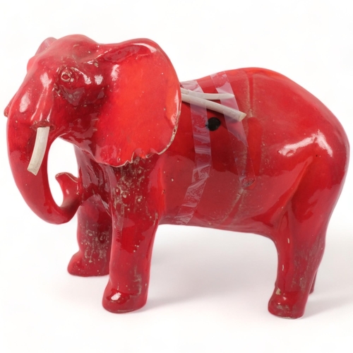 709 - A David Sharp Rye red pottery elephant figure (tusks broken but present), H34cm