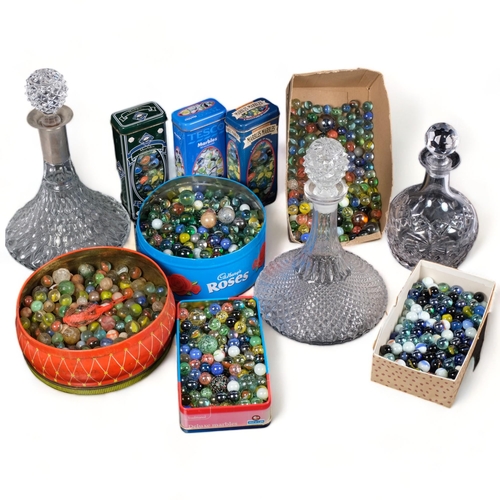 722 - A quantity of glass marbles, and 3 glass decanters and stoppers