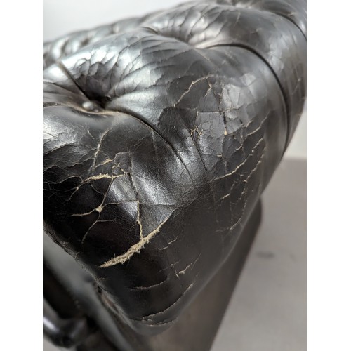 2712 - An vintage black leather Chesterfield style sofa. Overall 230x75x95cm, seat 163x42x60cm.