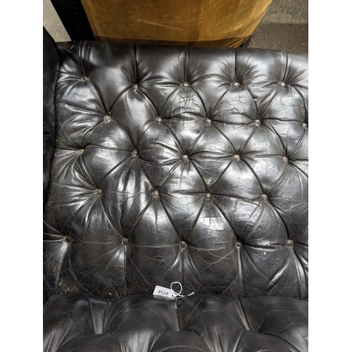 2712 - An vintage black leather Chesterfield style sofa. Overall 230x75x95cm, seat 163x42x60cm.