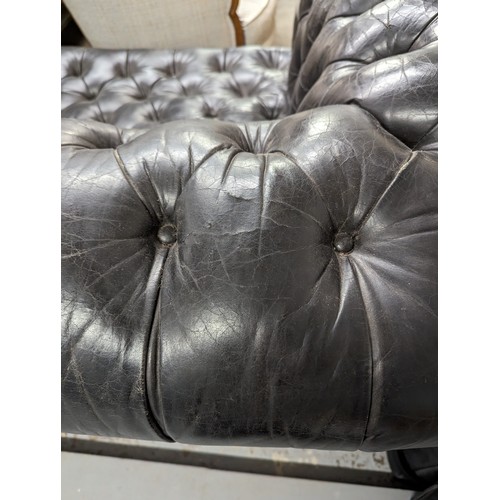 2712 - An vintage black leather Chesterfield style sofa. Overall 230x75x95cm, seat 163x42x60cm.