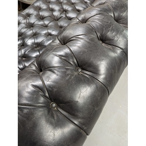 2712 - An vintage black leather Chesterfield style sofa. Overall 230x75x95cm, seat 163x42x60cm.