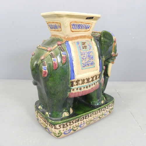 4 - A painted ceramic elephant design garden seat. 58x59x28cm.