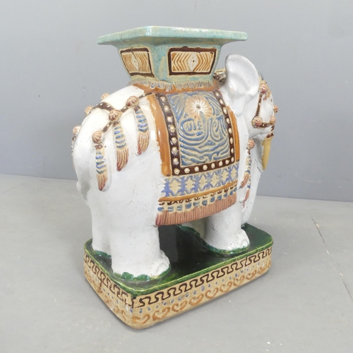 5 - A painted ceramic elephant design garden seat.54x58x28cm. 