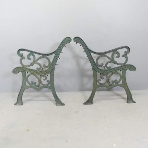 64 - A pair of painted cast iron bench ends. Height 78cm.