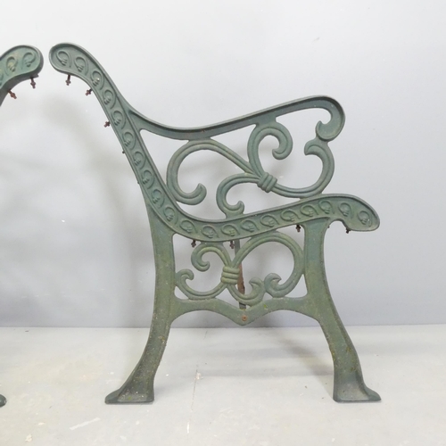 64 - A pair of painted cast iron bench ends. Height 78cm.