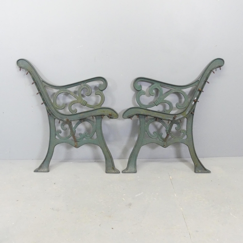 64 - A pair of painted cast iron bench ends. Height 78cm.