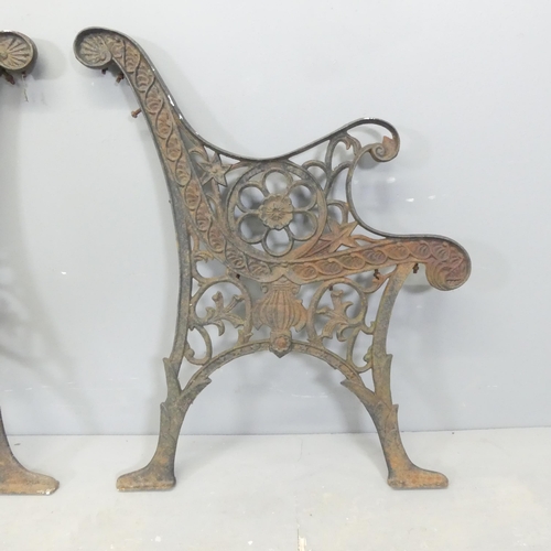 65 - A pair of painted cast-iron bench ends. Height 72cm.