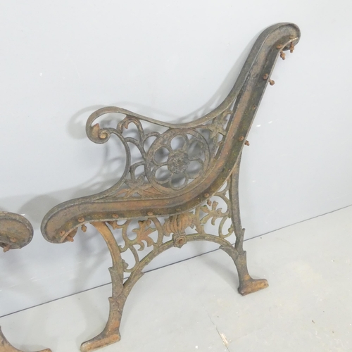 65 - A pair of painted cast-iron bench ends. Height 72cm.