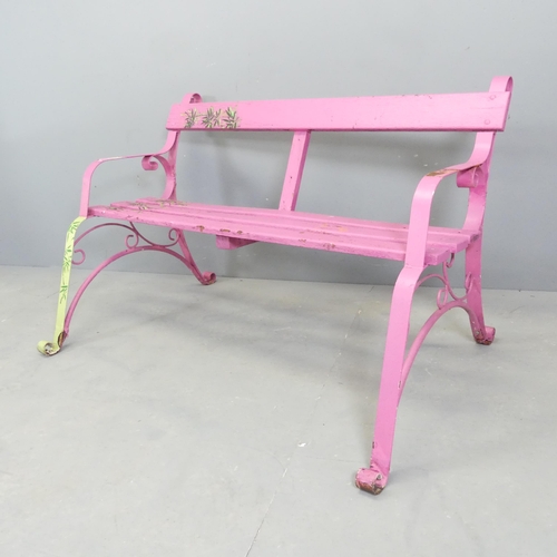 66 - A pink painted Victorian iron strapwork bench. 130x74x78cm.