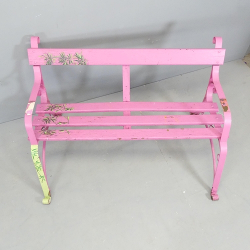 66 - A pink painted Victorian iron strapwork bench. 130x74x78cm.