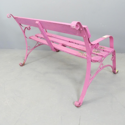 66 - A pink painted Victorian iron strapwork bench. 130x74x78cm.