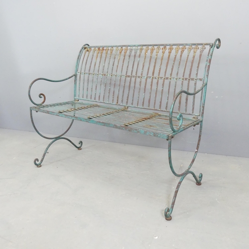 67 - A painted and weathered iron garden bench. 103x85x60cm.