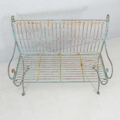 67 - A painted and weathered iron garden bench. 103x85x60cm.