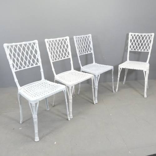 68 - A set of four painted cast aluminium garden chairs, with bamboo effect decoration.