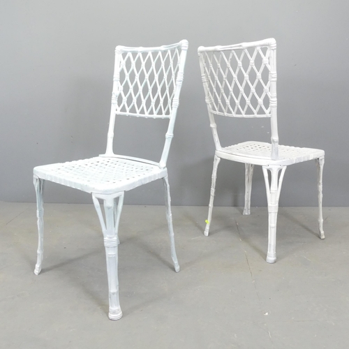 68 - A set of four painted cast aluminium garden chairs, with bamboo effect decoration.