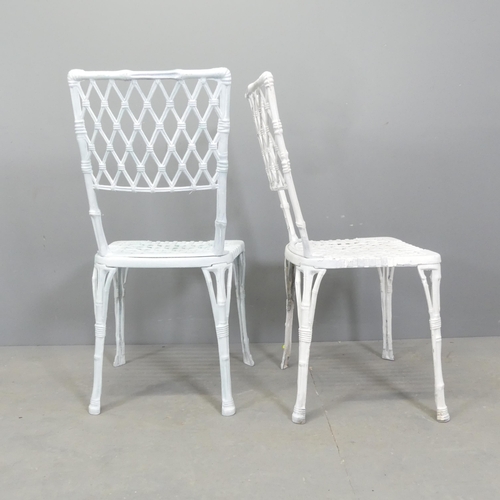 68 - A set of four painted cast aluminium garden chairs, with bamboo effect decoration.