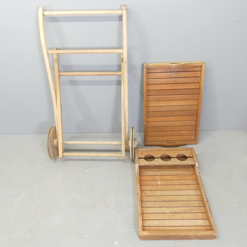 18 - A weathered teak two-tier garden drinks trolley. Overall 90x80x70cm.