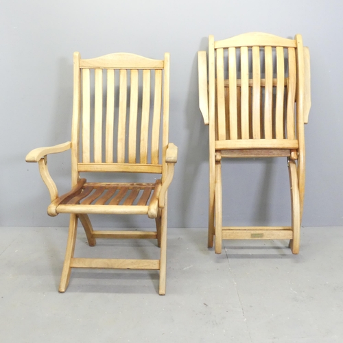 20 - ALEXANDER ROSE - A pair of roble wood Bengal folding carver chairs, with maker's plaques to rear str... 