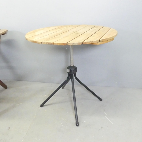 21 - Two teak folding garden tables, and a circular folding table on tubular metal stand. (3).