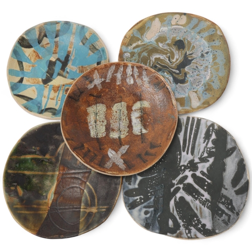 104 - JANE ABBOTT , a set of 5 slab ceramic plates, glaze notes to back, largest diameter 17cm