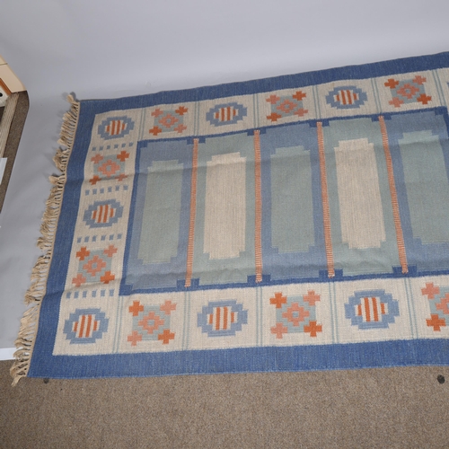 109 - A Swedish flatweave rug, with a geometric pattern in shades of blue and dark pink, 205 X 140cms