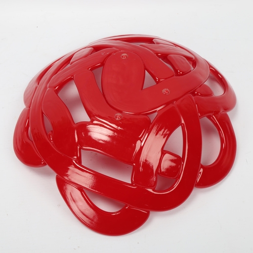 127 - ANNA EHRNER for Kosta Boda, a red glass lattice bowl, makers label, diameter 29cm