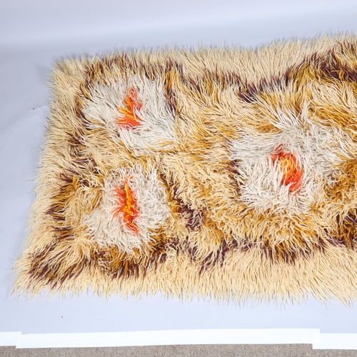 142 - A 1960s'/70s' long shag pile wool rug, 210 x 100cm