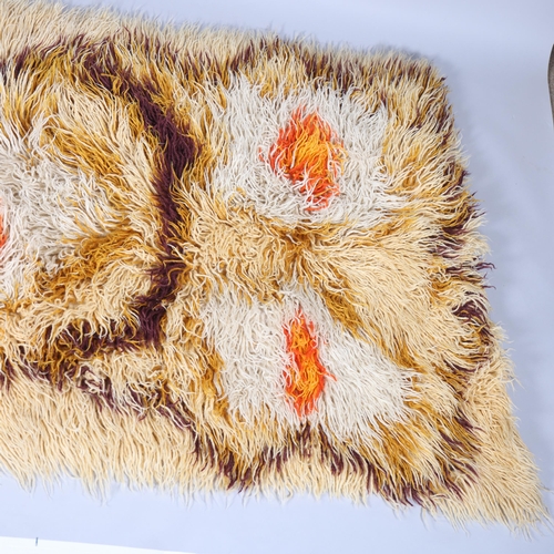 142 - A 1960s'/70s' long shag pile wool rug, 210 x 100cm