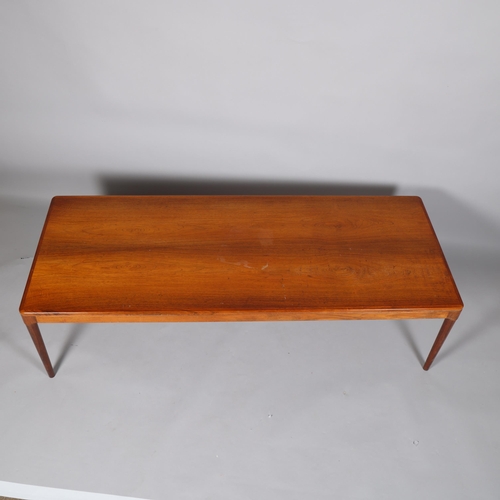 149 - ARNE HOUMAND-OLSEN for Morgens-Kold, Denmark, a 1960s rosewood coffee table, makers label under top,... 