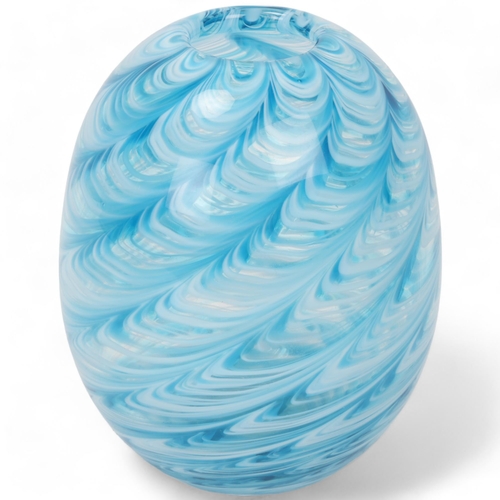 179 - LIAM CAREY, a hand made swirled blue/white glass vase, makers label to base, height 14cm