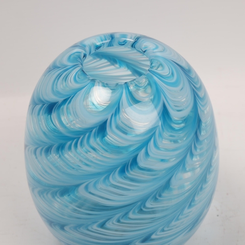 179 - LIAM CAREY, a hand made swirled blue/white glass vase, makers label to base, height 14cm