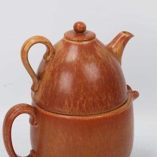 181 - GUNNAR NYLUND for Rorstrand, Sweden, a stoneware stacking tea pot and hot water jug, designed 1950s'... 