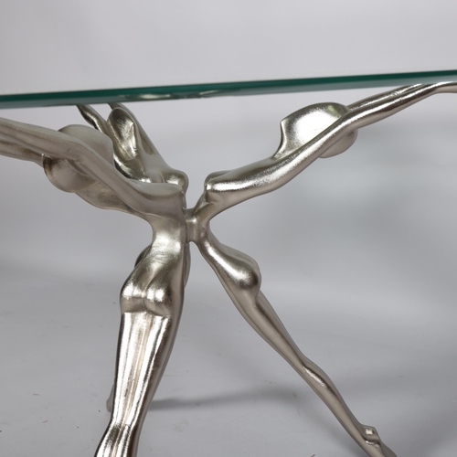 185 - A cast aluminium and glass coffee table, the base with conjoined outstretched nudes, height 54cm, di... 