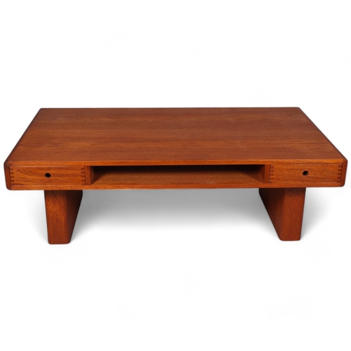 207 - A mid 20th century teak coffee table by Trioh, Denmark, with two double sided sliding drawers and st... 