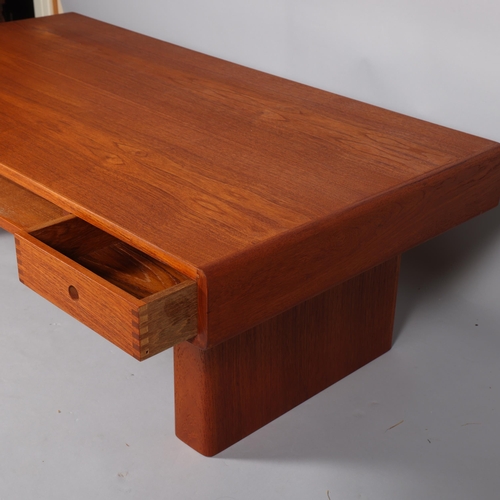 207 - A mid 20th century teak coffee table by Trioh, Denmark, with two double sided sliding drawers and st... 